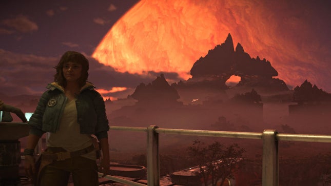 Kai stood in front of a group of planets, the Rocky Mountains silhouetted against an orange sky.